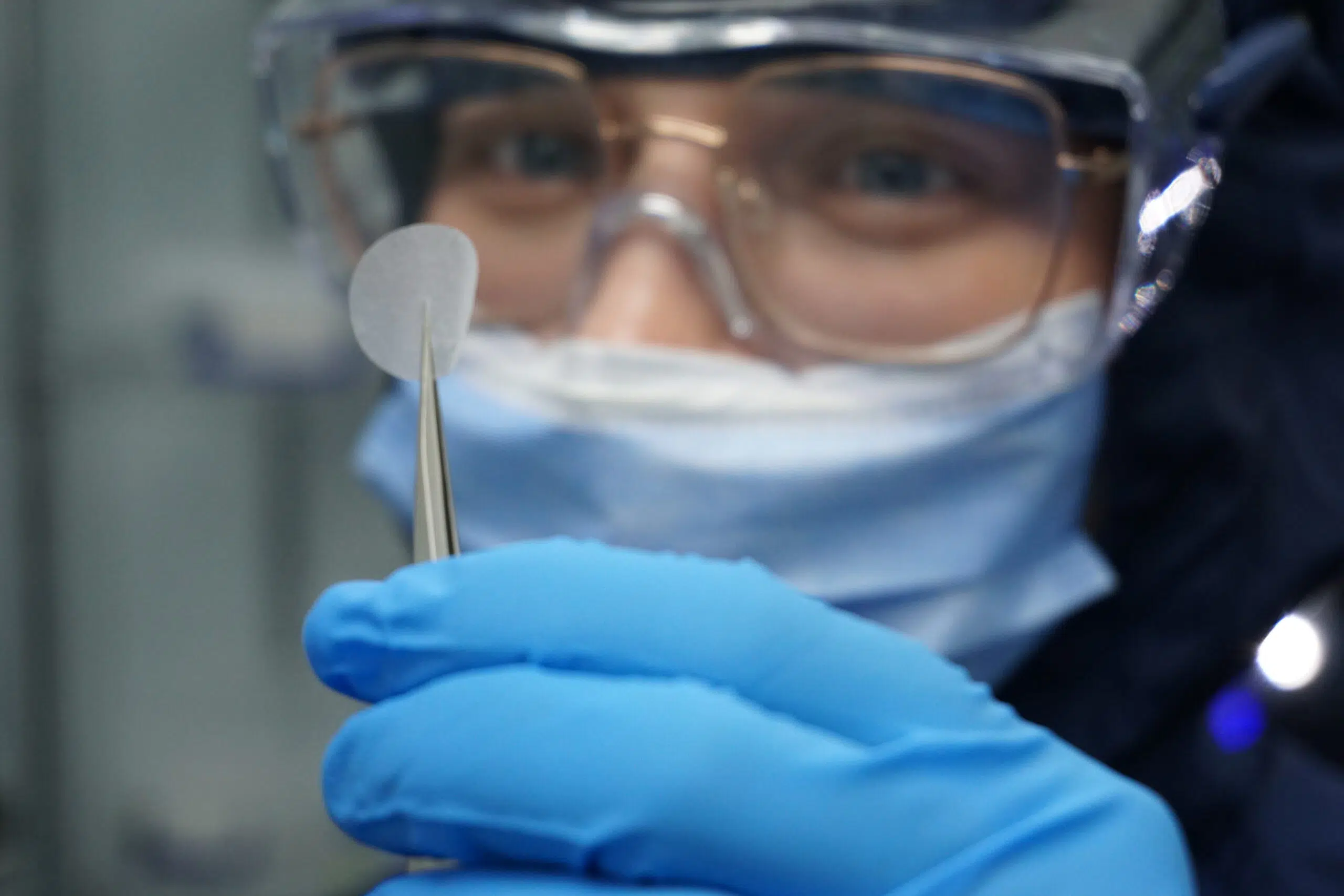 Electrospun wound healing membrane and thicker porous prototype beside a Symatix material sample.